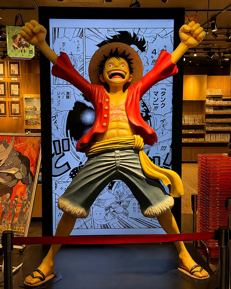 Monkey D. Luffy statue from One Piece on display in a Shibuya manga store